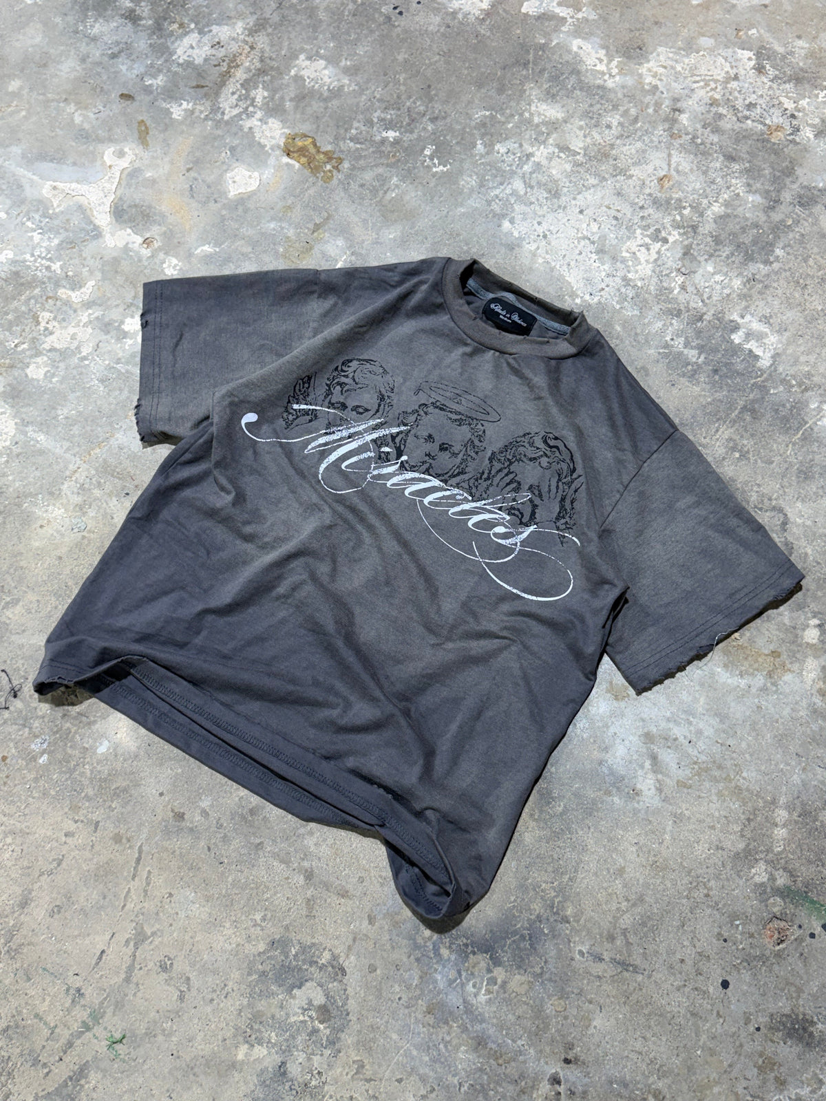 "no evil" tee flat lay